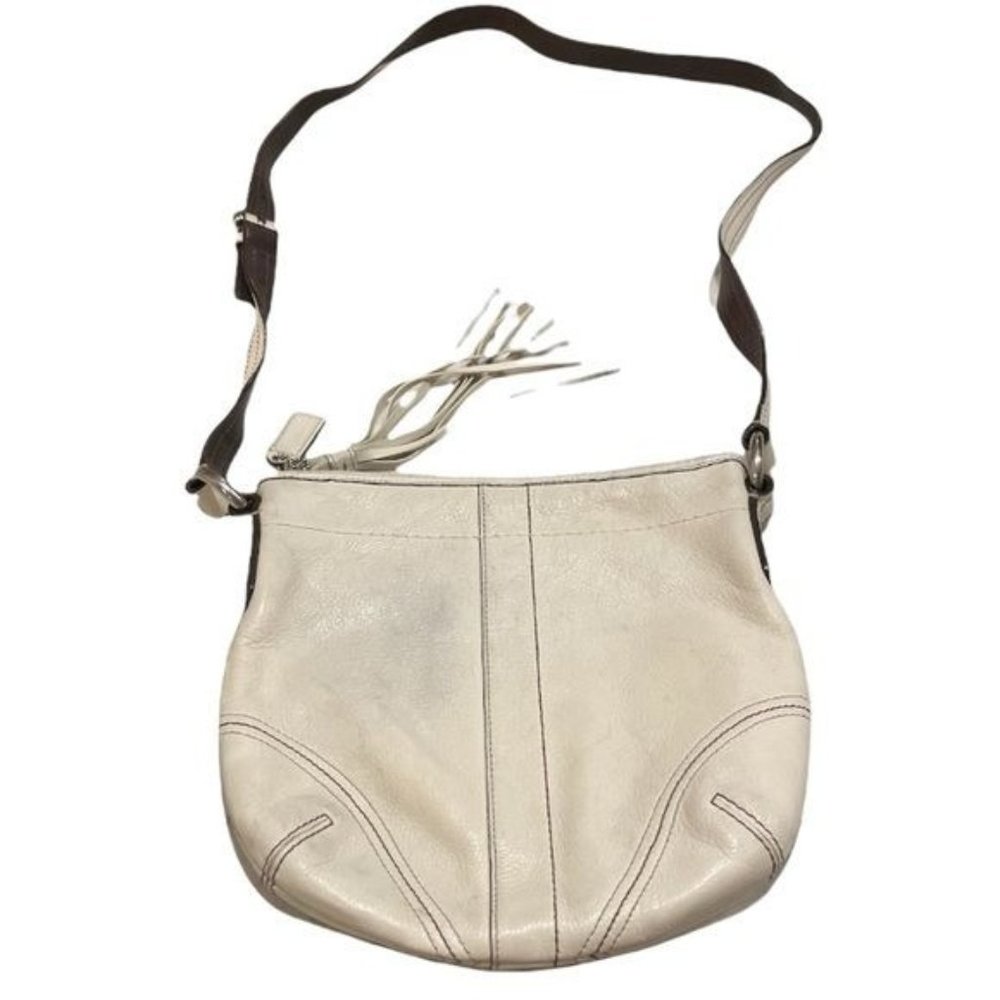 Coach Crossbody Bag Cream leather Brown lining pockets zip closure tassel